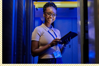 A woman working near servers